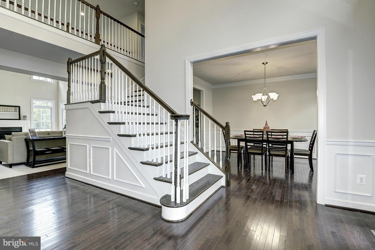 4125 Briars Road Olney, MD 20832 - Photo 3 of 29 a view of dining room with wooden floor and stairs