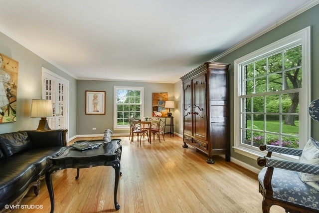1719 Spring Creek Road Barrington Hills, IL 60010 - Photo 13 of 26 a living room with furniture and a large window