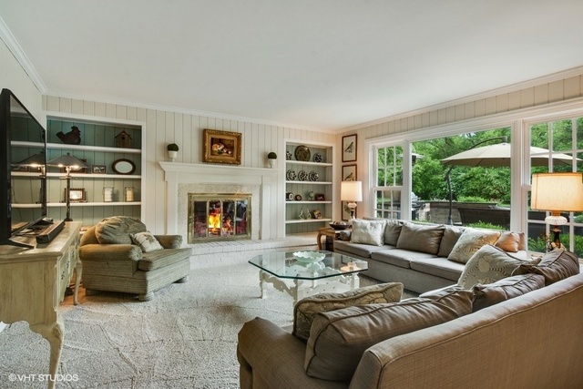 1719 Spring Creek Road Barrington Hills, IL 60010 - Photo 16 of 26 a living room with furniture and a fireplace