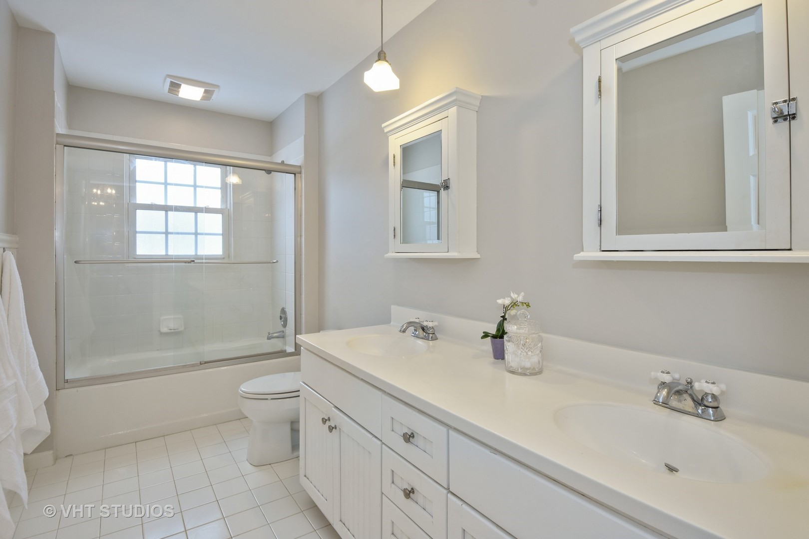 1719 Spring Creek Road Barrington Hills, IL 60010 - Photo 20 of 26 a bathroom with a sink a toilet and shower