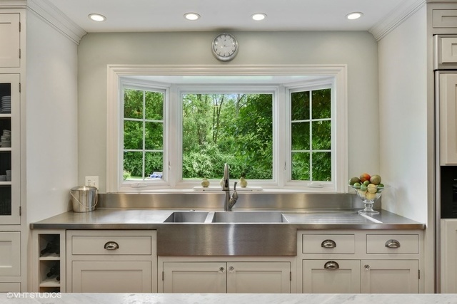 1719 Spring Creek Road Barrington Hills, IL 60010 - Photo 5 of 26 a kitchen with kitchen island a large window cabinets and stainless steel appliances