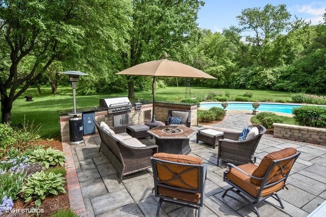 1719 Spring Creek Road Barrington Hills, IL 60010 - Photo 10 of 26 a view of a patio with furniture and a yard