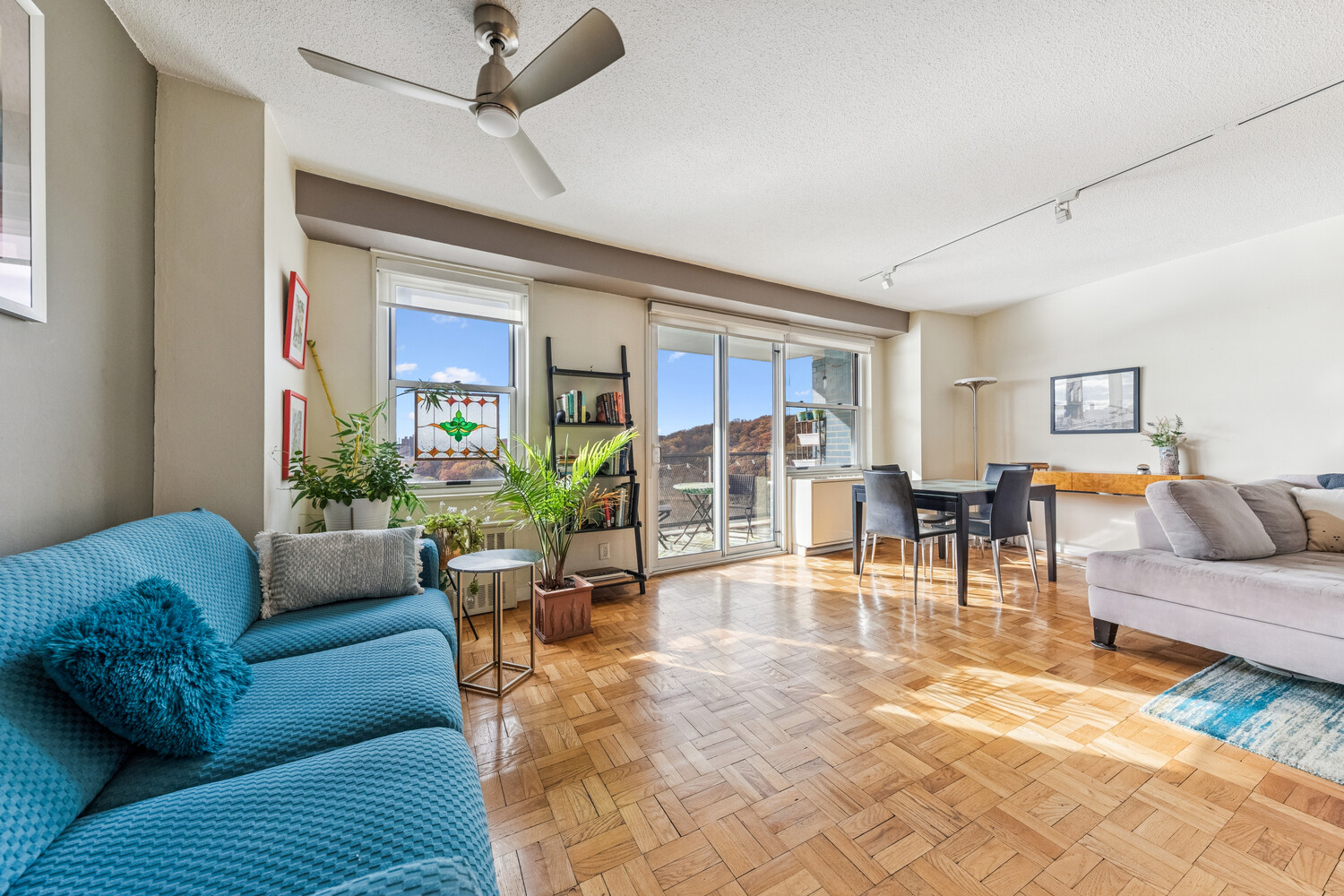 2400 Johnson Avenue, Unit 5F Bronx, NY 10463 - Photo 2 of 14 a living room with furniture and a large window