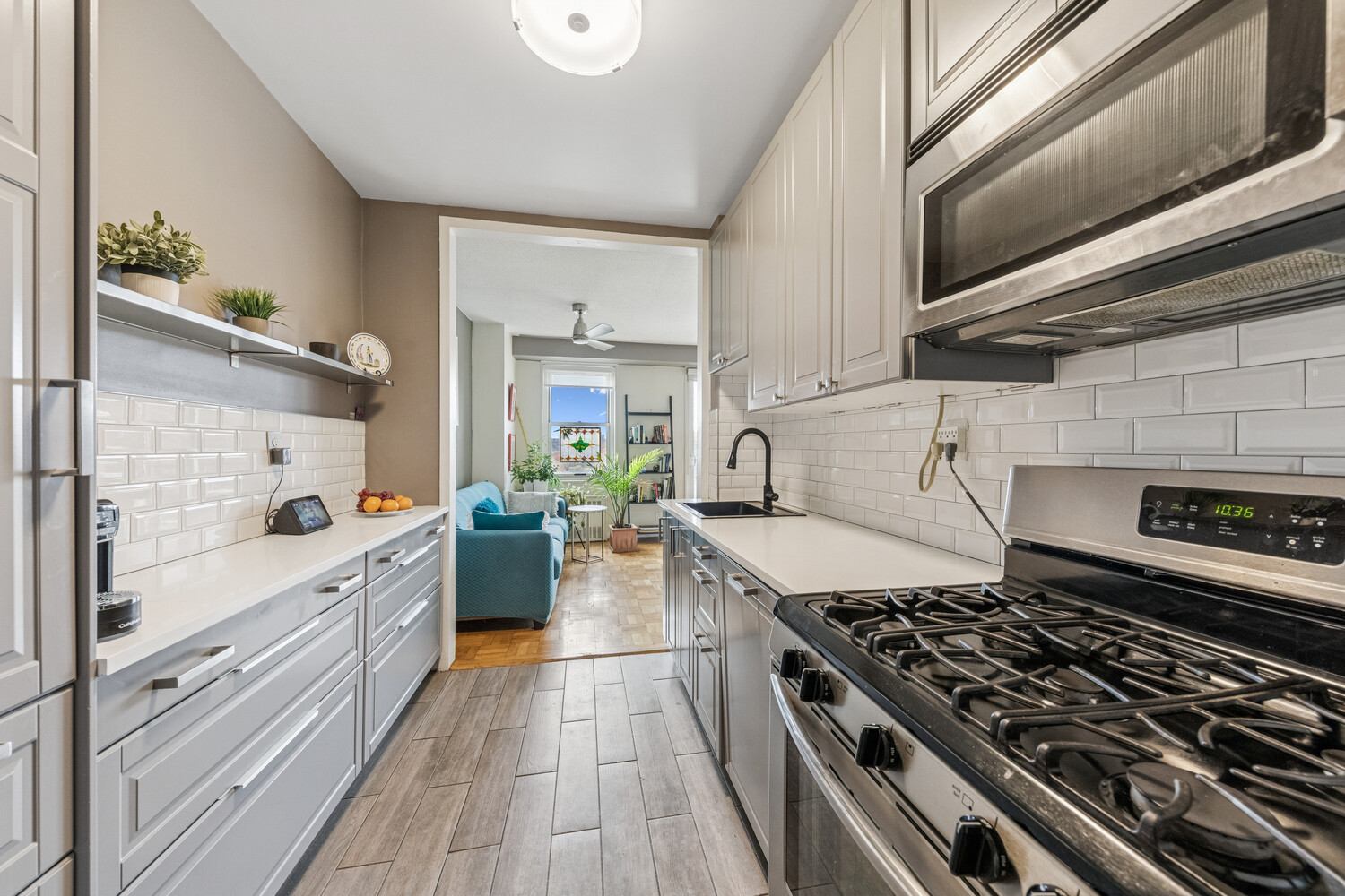 2400 Johnson Avenue, Unit 5F Bronx, NY 10463 - Photo 10 of 14 a kitchen with a stove and white cabinets