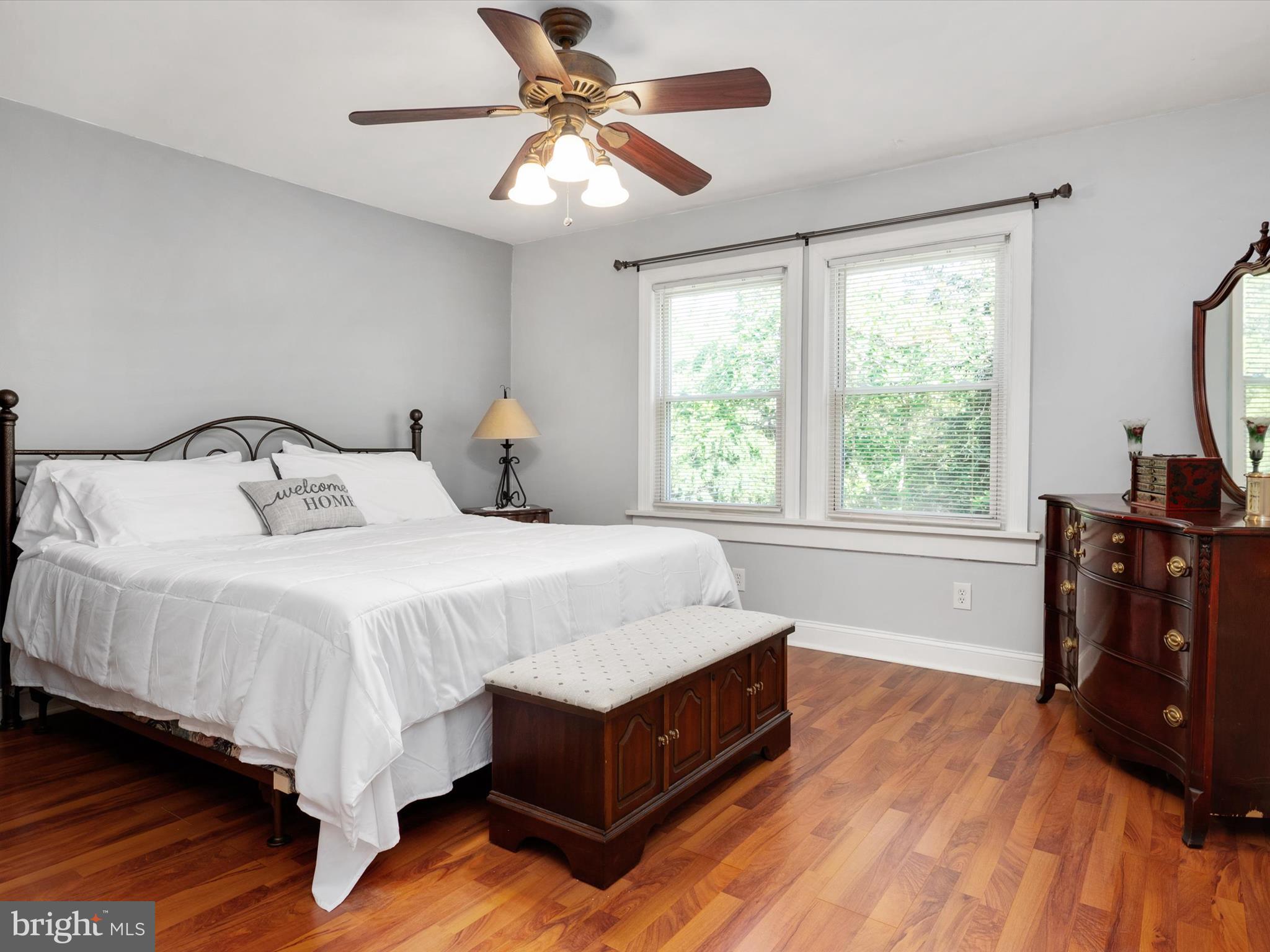 1101 Furnace Road Linthicum Heights, MD 21090 - Photo 42 of 73 a spacious bedroom with a bed and wooden floor