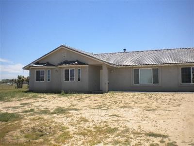 7225 Cambria Road Phelan, CA 92371 - Photo 1 of 1 a front view of a house with a yard