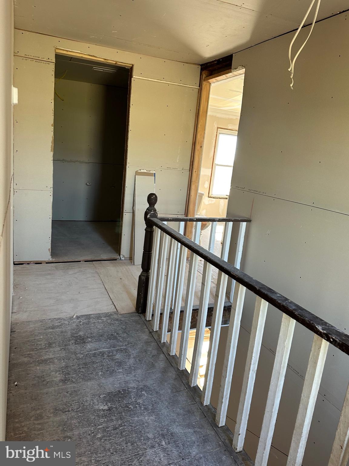24872 Meeting House Road Denton, MD 21629 - Photo 27 of 73 a view of a hallway with wooden floor and staircase