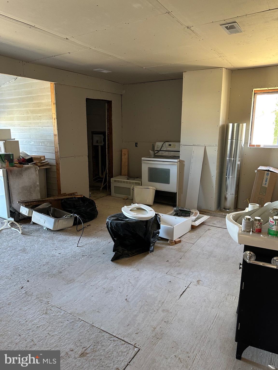 24872 Meeting House Road Denton, MD 21629 - Photo 50 of 73 a living room with furniture a flat screen tv and a fireplace