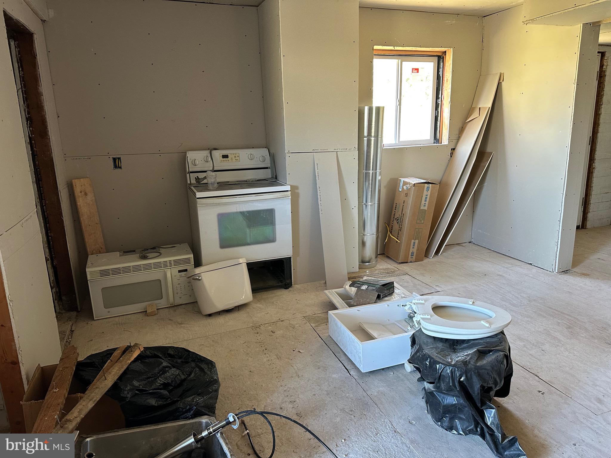 24872 Meeting House Road Denton, MD 21629 - Photo 53 of 73 a living room with furniture and a fireplace