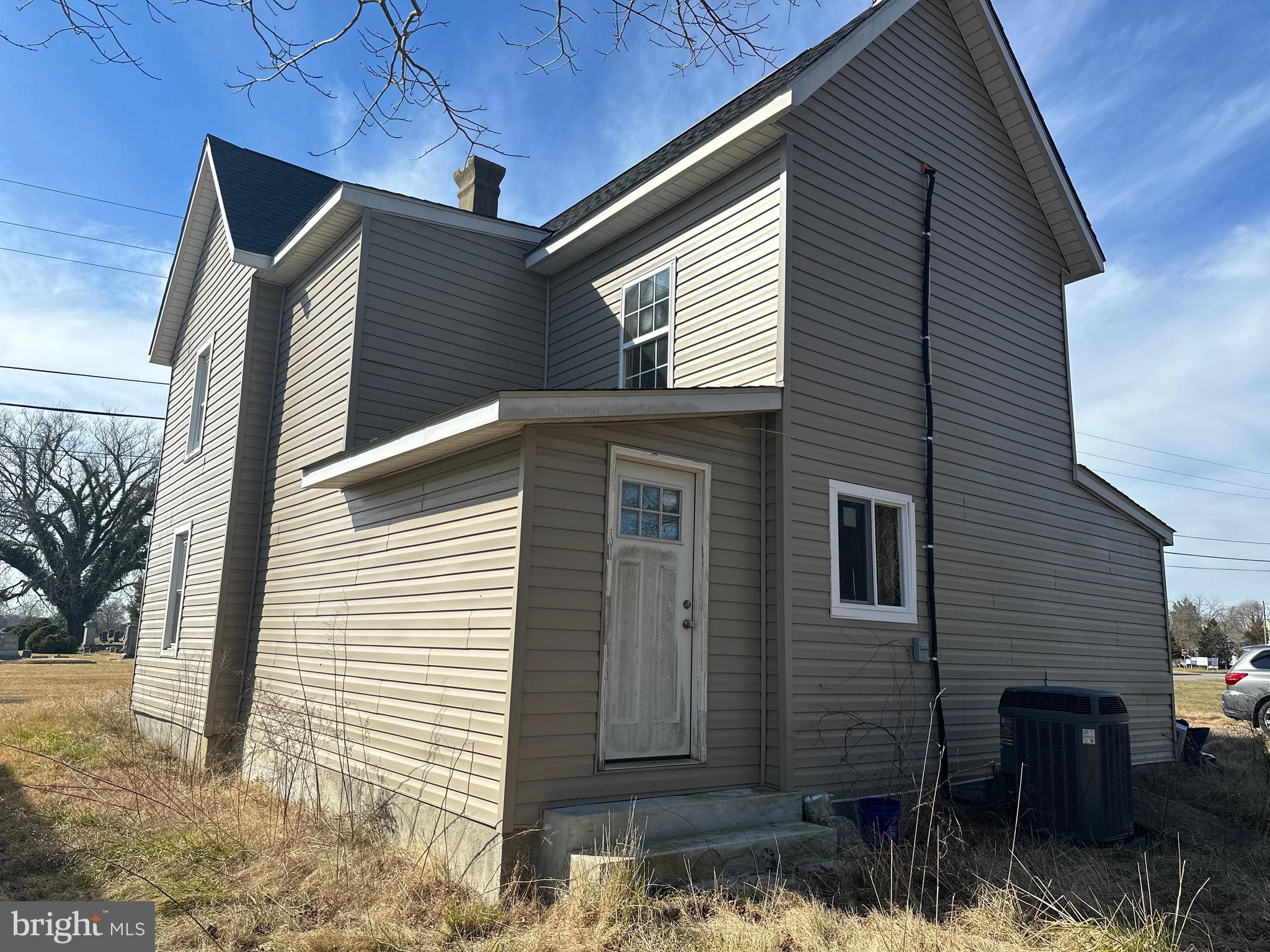 24872 Meeting House Road Denton, MD 21629 - Photo 10 of 73 a front view of a house with a yard