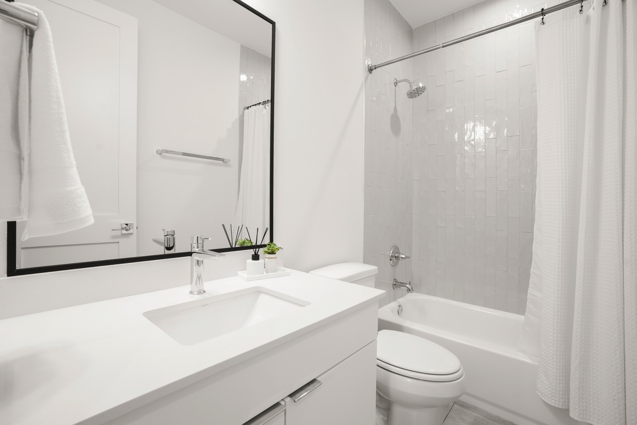 595 Old Mill Road, Unit 206 Cedar Park, TX 78613 - Photo 23 of 39 The full ensuite bathroom comes with tastefully selected modern finishes and a shower/tub combo with tiled backsplash.