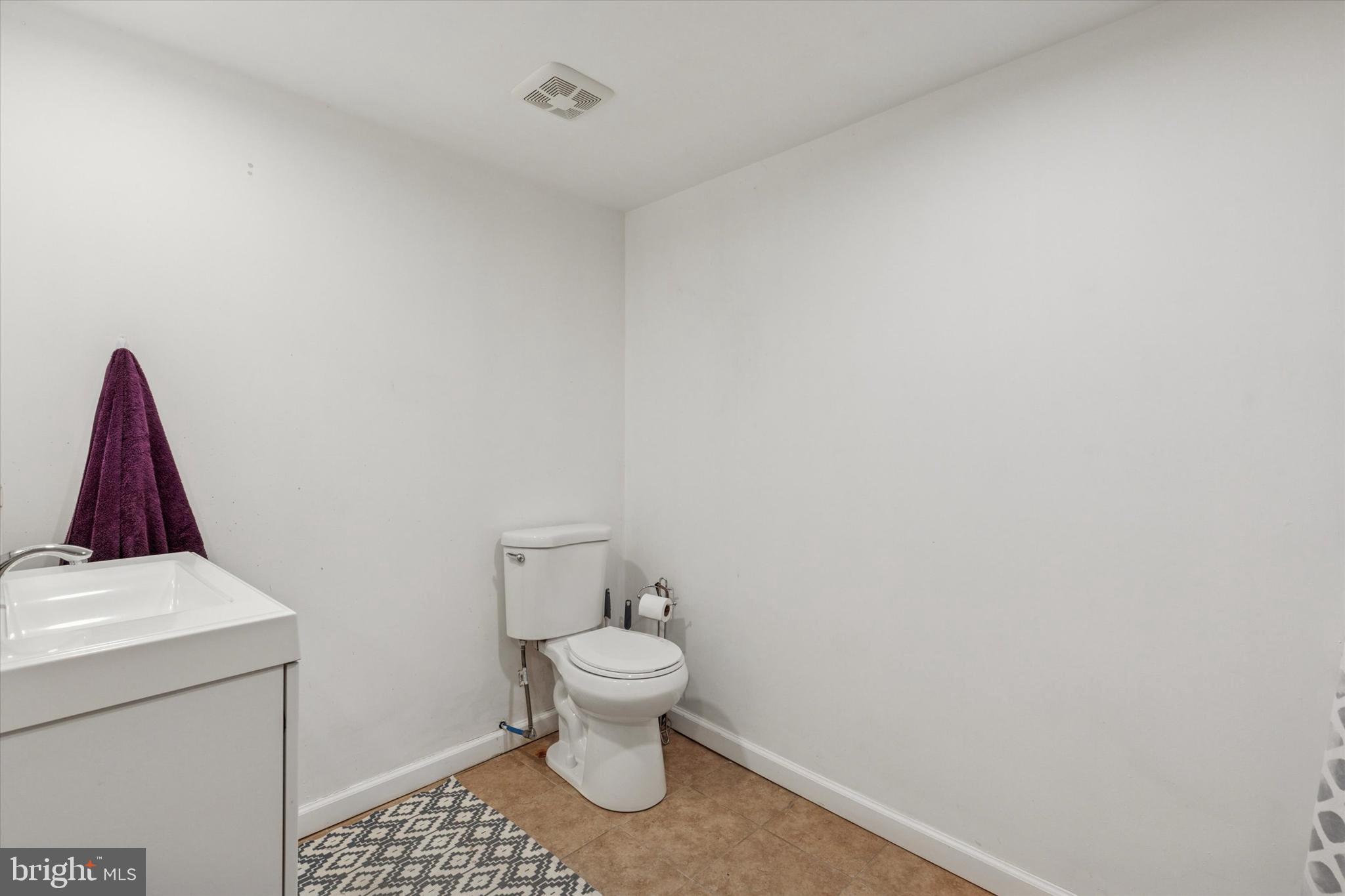 290 Hatboro Road Ivyland, PA 18974 - Photo 22 of 45 a white toilet sitting next to a white cabinet