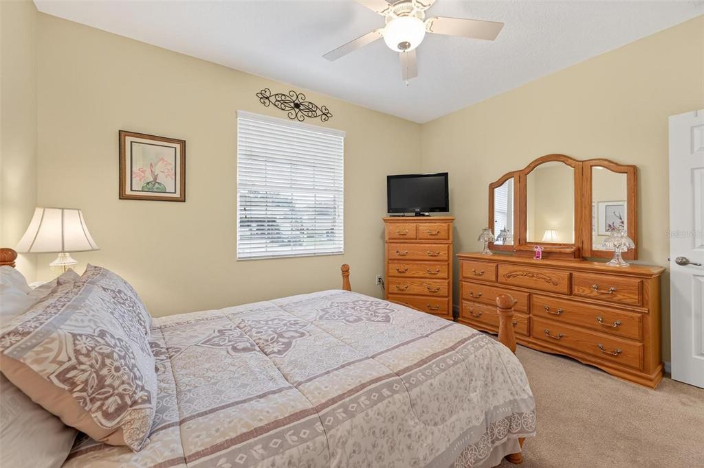 8336 Southwest 77th Court Ocala, FL 34476 - Photo 11 of 47 a bedroom with a bed and a dresser