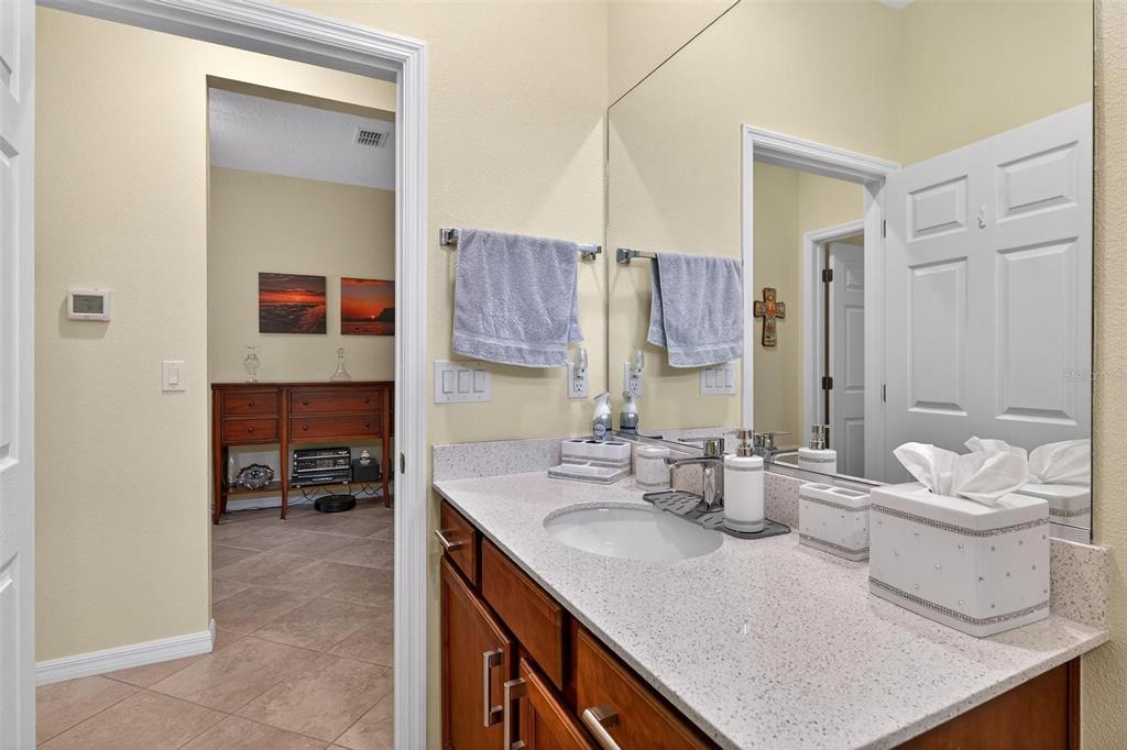 8336 Southwest 77th Court Ocala, FL 34476 - Photo 15 of 47 a en suite bathroom with a sink double vanity and a mirror