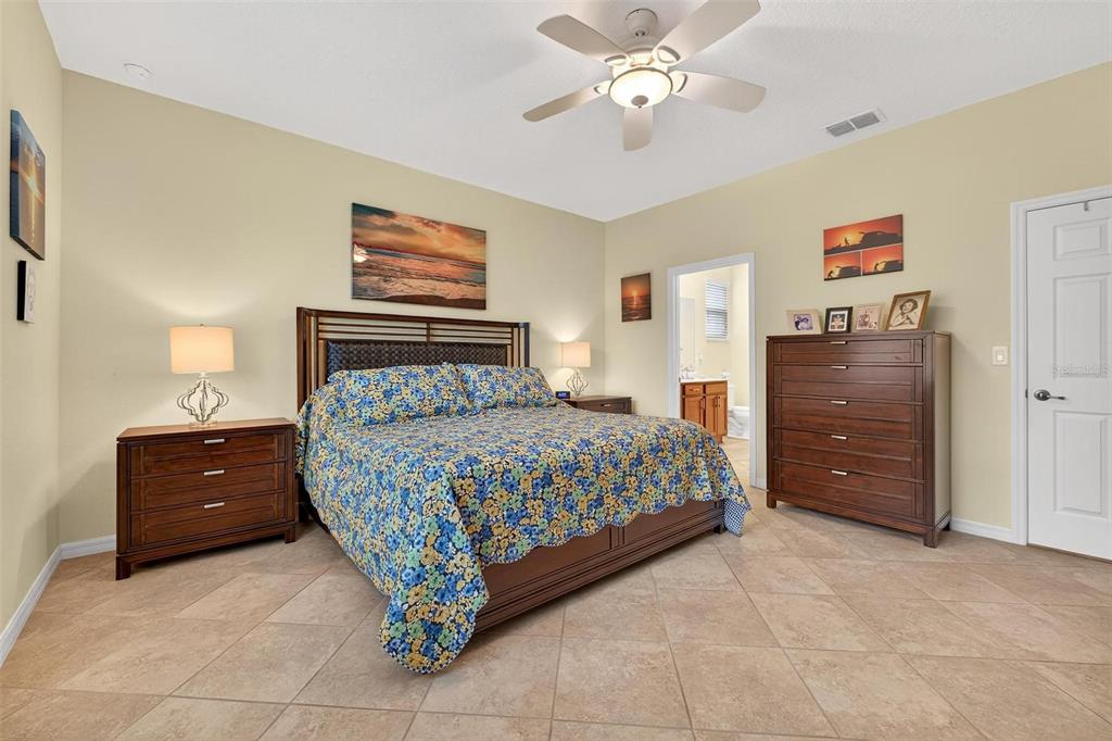 8336 Southwest 77th Court Ocala, FL 34476 - Photo 23 of 47 a bedroom with a bed and cabinets