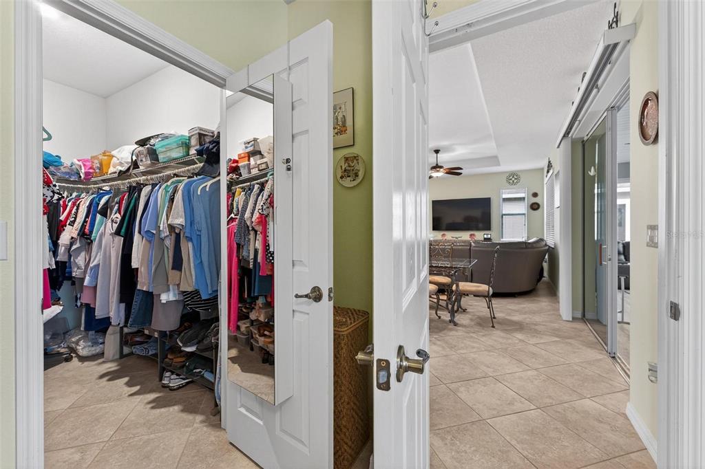 8336 Southwest 77th Court Ocala, FL 34476 - Photo 26 of 47 a view of walk in closet with clothes