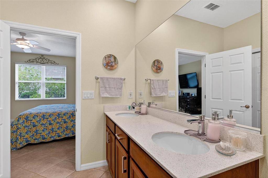 8336 Southwest 77th Court Ocala, FL 34476 - Photo 28 of 47 a bathroom with a sink double vanity and a mirror