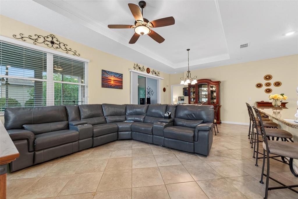 8336 Southwest 77th Court Ocala, FL 34476 - Photo 40 of 47 a living room with furniture and a chandelier