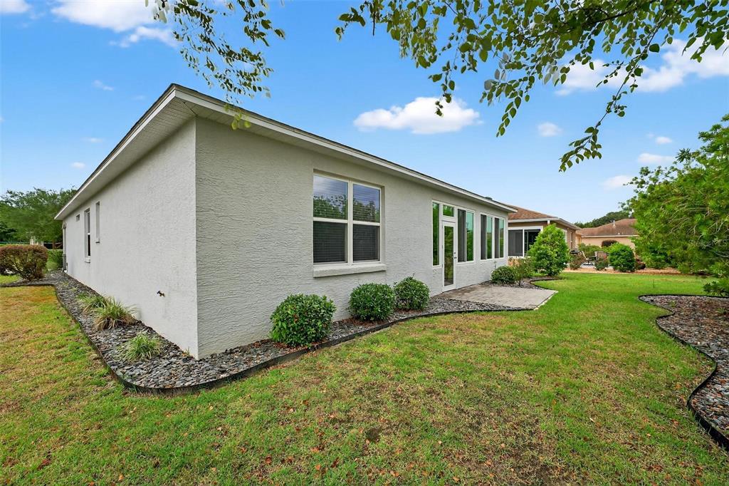 8336 Southwest 77th Court Ocala, FL 34476 - Photo 45 of 47 a view of a house with backyard and garden