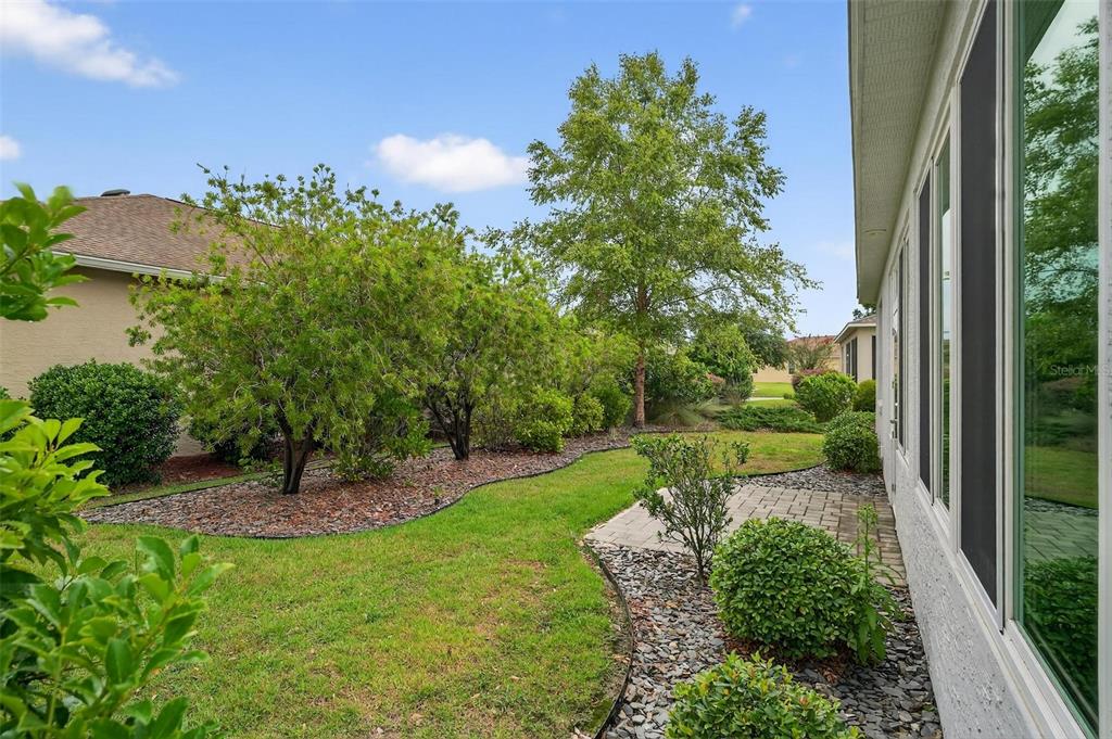 8336 Southwest 77th Court Ocala, FL 34476 - Photo 47 of 47 a view of a garden with a fountain