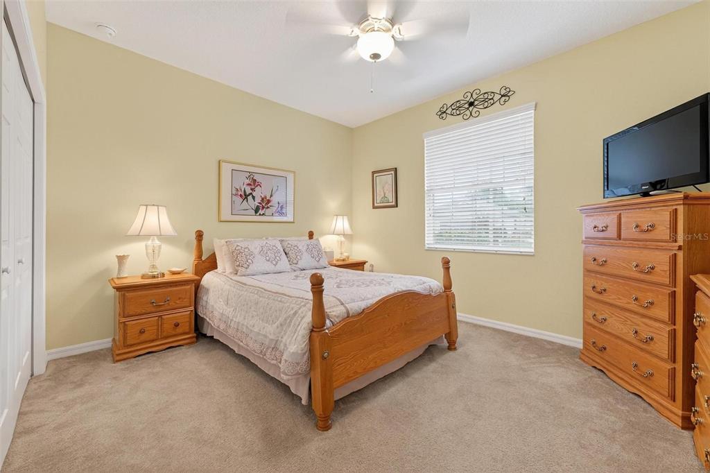 8336 Southwest 77th Court Ocala, FL 34476 - Photo 9 of 47 a bed room with a bed and a television