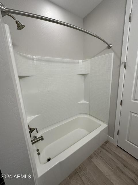 13209 West Roy Rogers Road Peoria, AZ 85383 - Photo 13 of 22 a bathroom with a tub and a shower