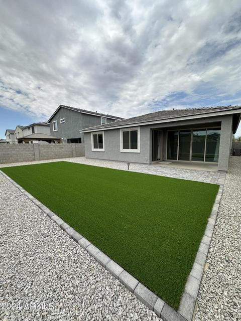 13209 West Roy Rogers Road Peoria, AZ 85383 - Photo 21 of 22 a front view of house with yard and green space