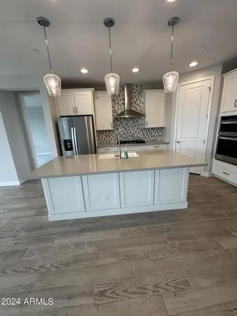 a view of a kitchen with a sink and dishwasher