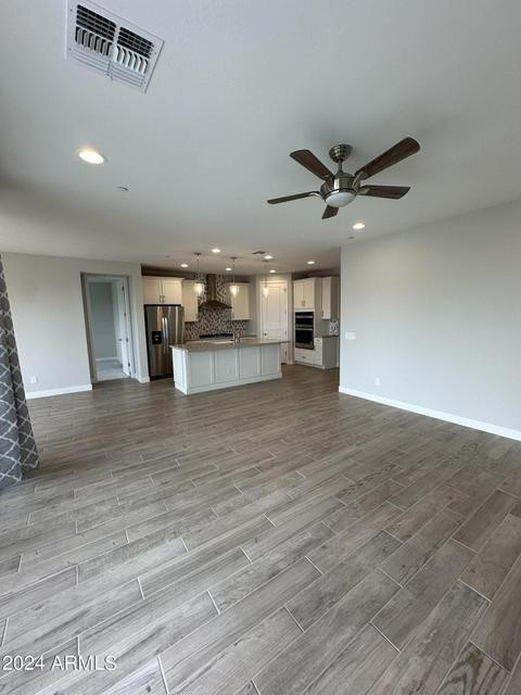 13209 West Roy Rogers Road Peoria, AZ 85383 - Photo 6 of 22 a view of a kitchen with a sink and a refrigerator