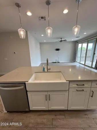 a view of a room with wooden floor
