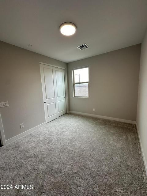 13209 West Roy Rogers Road Peoria, AZ 85383 - Photo 9 of 22 an empty room with a empty space and windows
