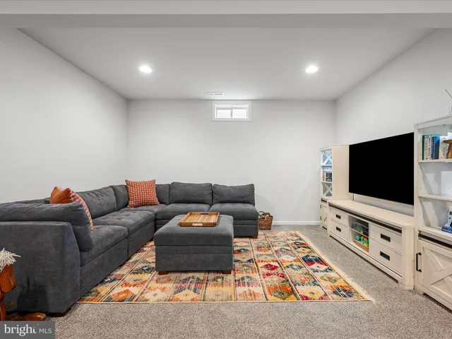 a front view of a house with plants