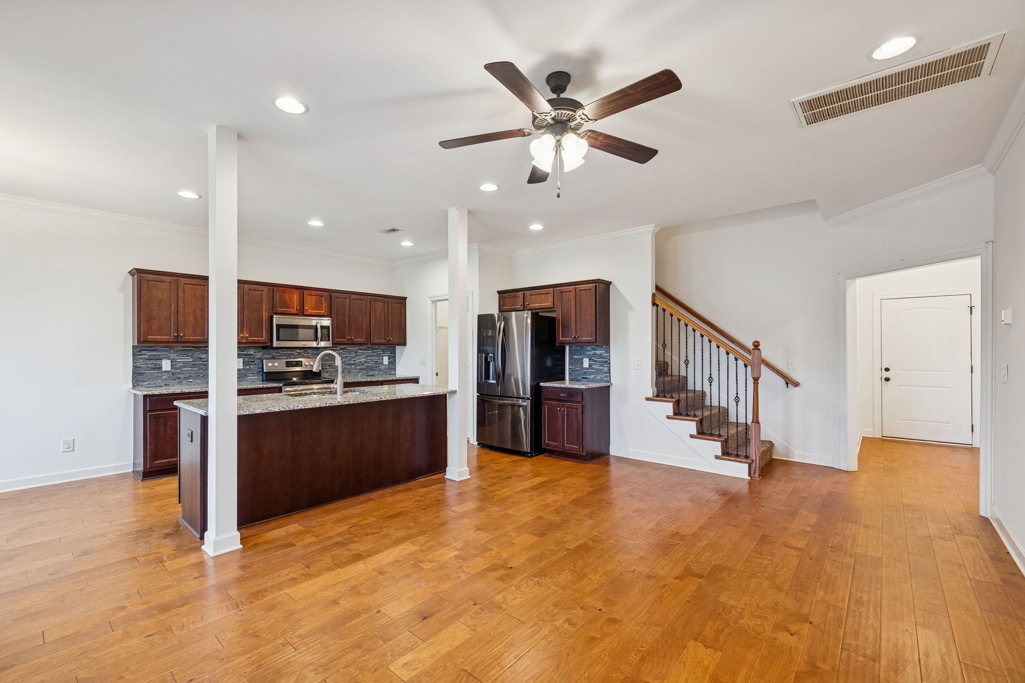 2912 Butterfly Bend Murfreesboro, TN 37129 - Photo 14 of 48 a large white kitchen with stainless steel appliances kitchen island a large counter top and a sink