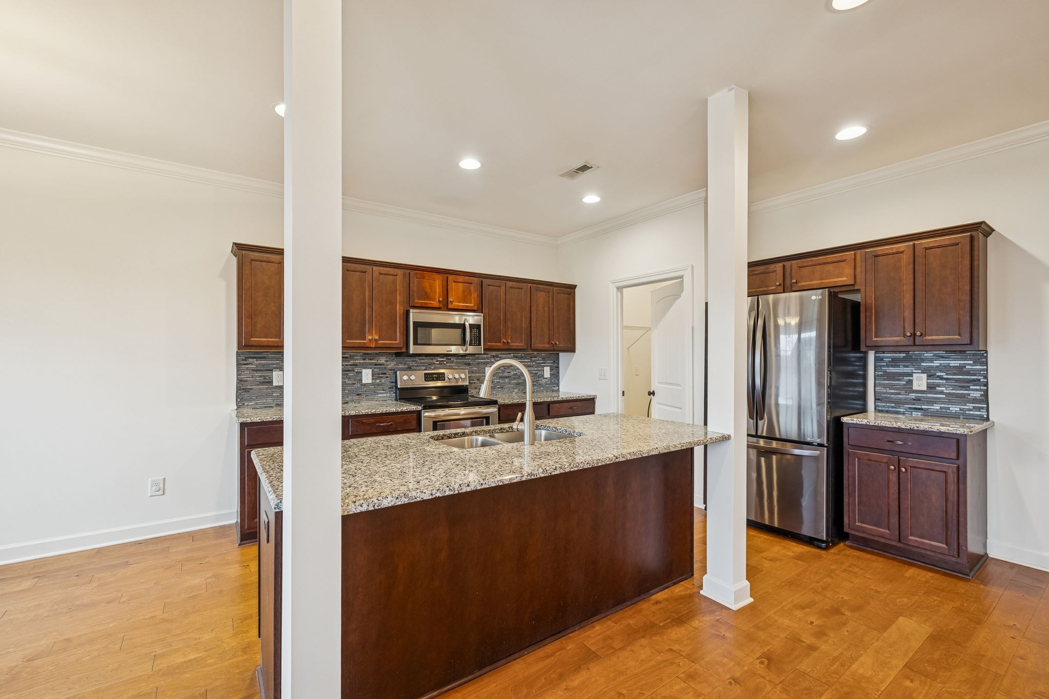 2912 Butterfly Bend Murfreesboro, TN 37129 - Photo 17 of 48 a kitchen with stainless steel appliances granite countertop a refrigerator a sink and a stove
