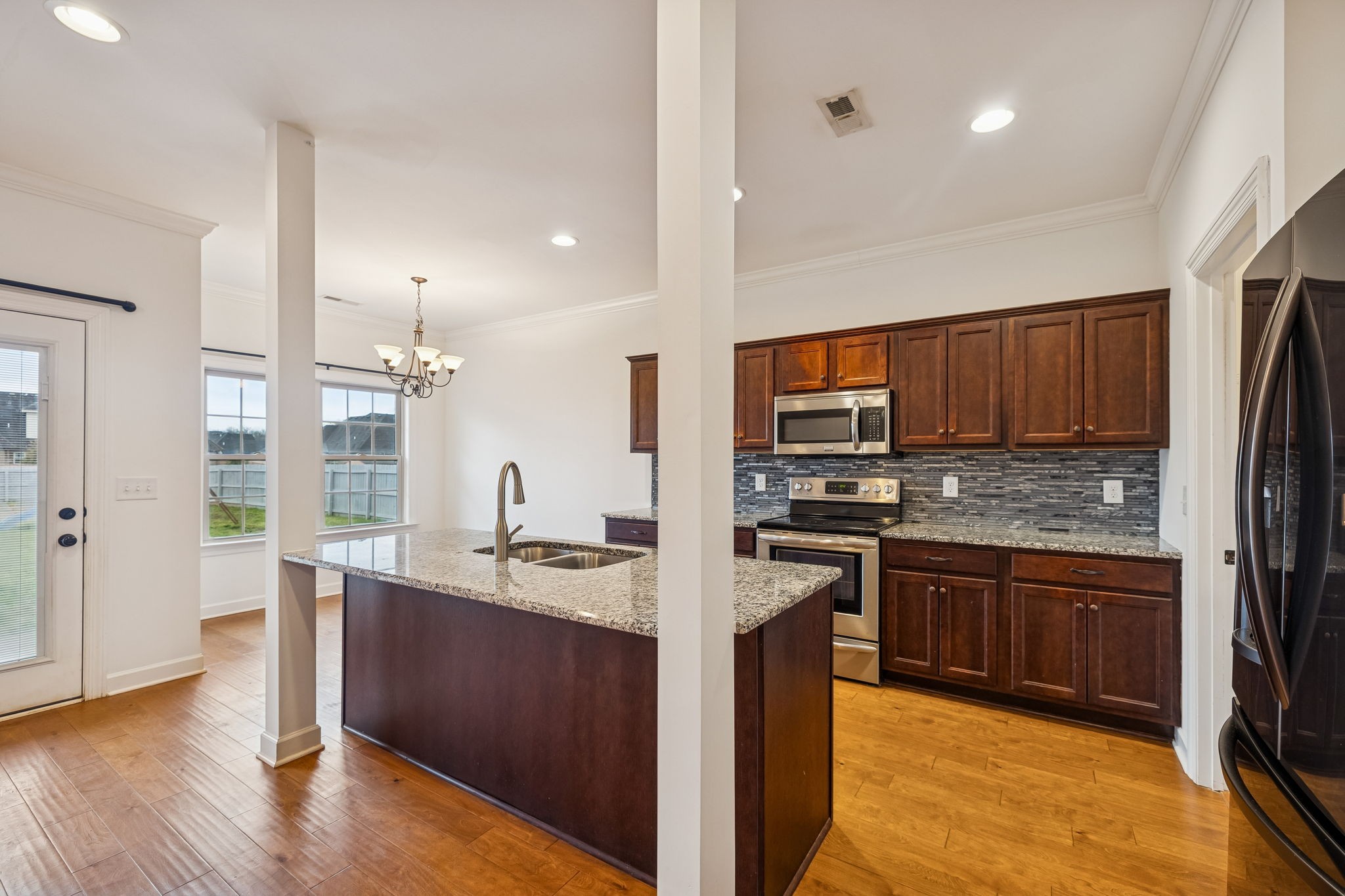 2912 Butterfly Bend Murfreesboro, TN 37129 - Photo 19 of 48 a kitchen with stainless steel appliances granite countertop a sink stove and refrigerator