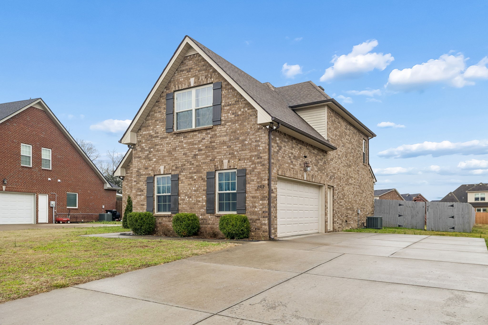 2912 Butterfly Bend Murfreesboro, TN 37129 - Photo 2 of 48 a front view of a house with a yard and garage