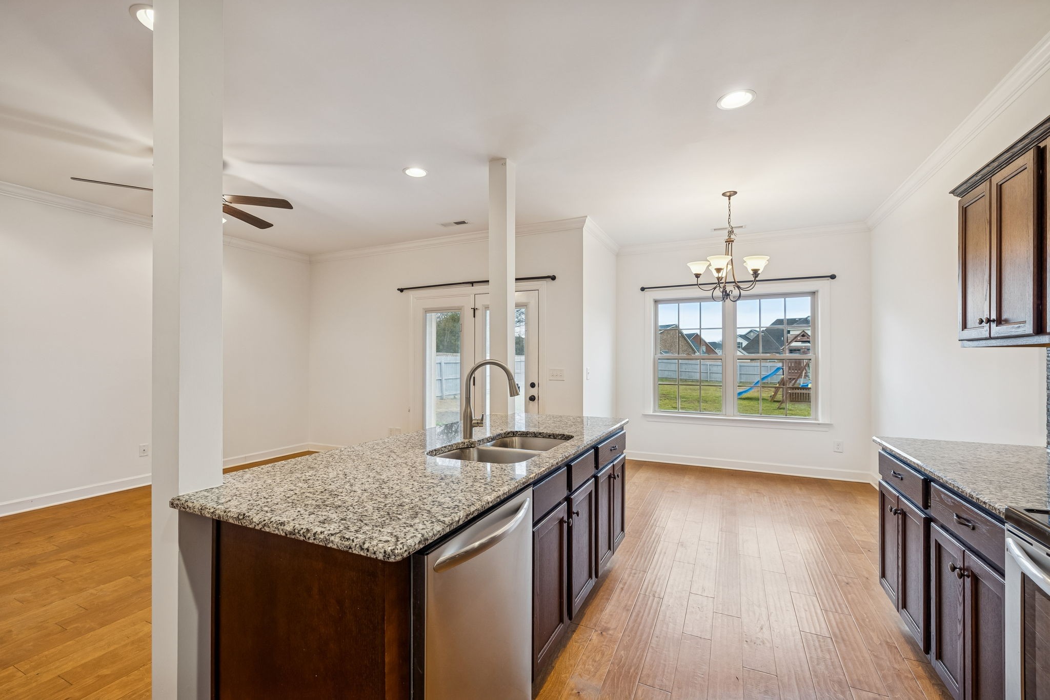 2912 Butterfly Bend Murfreesboro, TN 37129 - Photo 22 of 48 a kitchen with stainless steel appliances granite countertop a sink a stove and a wooden floors