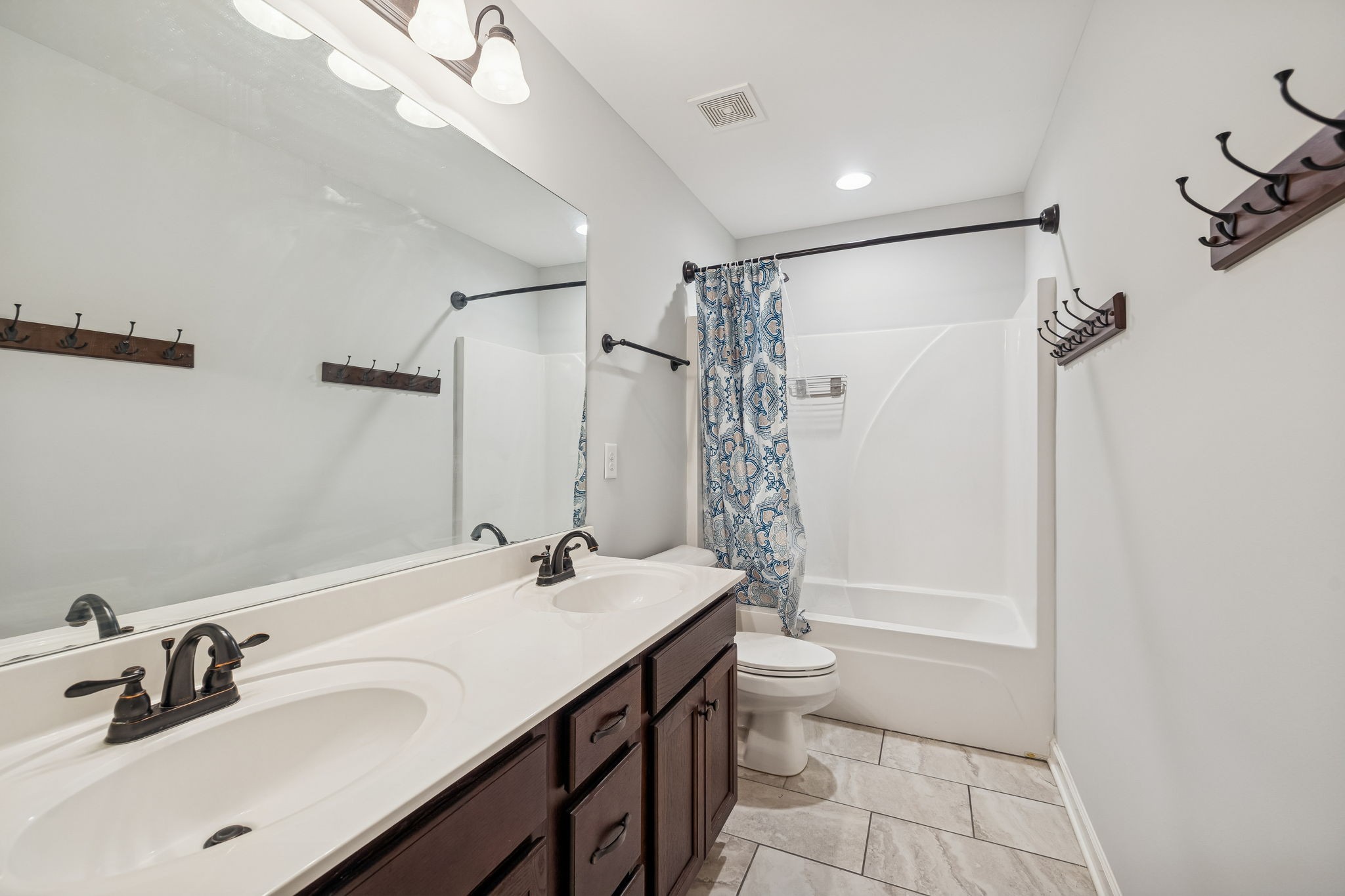 2912 Butterfly Bend Murfreesboro, TN 37129 - Photo 37 of 48 a bathroom with a double vanity sink toilet mirror and shower