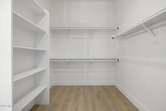 a bathroom with a double vanity sink toilet and shower