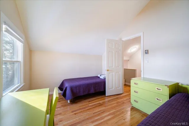 a bedroom with a bed and a closet