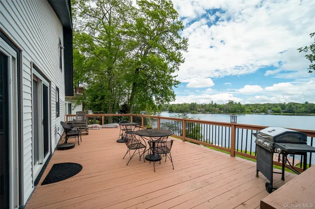 a view of a deck with two chairs and a table