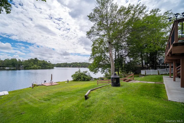 a view of a lake with houses in the back
