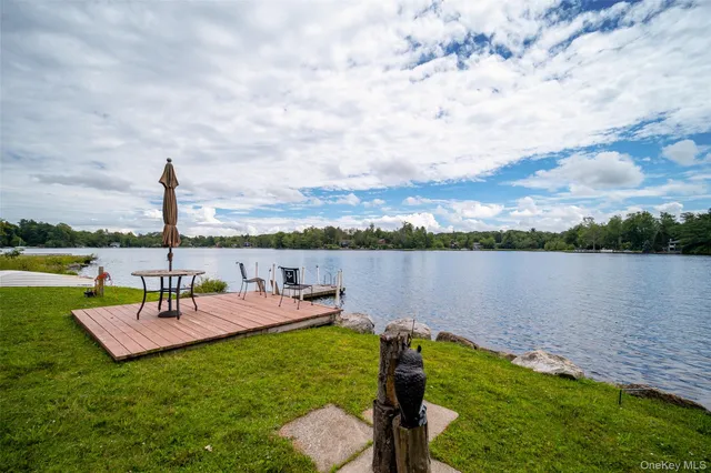 a view of a lake with sitting area