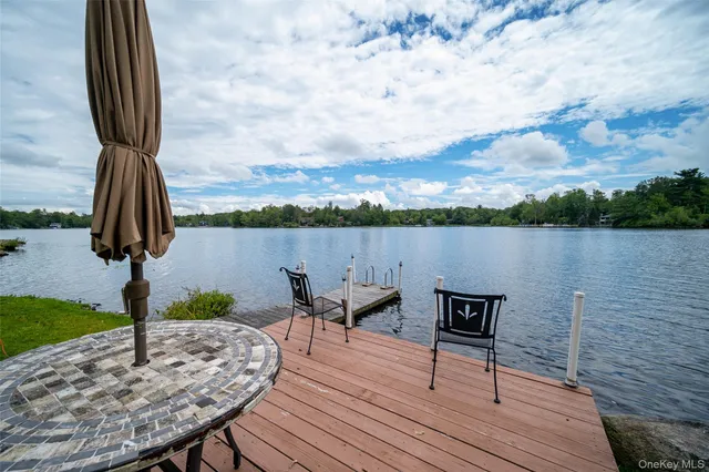 a view of a lake with sitting area