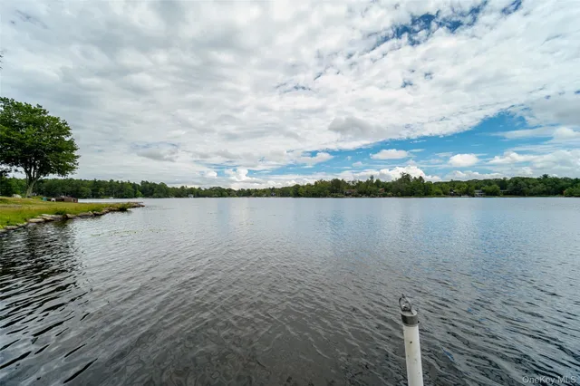 a view of a house with a yard porch and sitting area