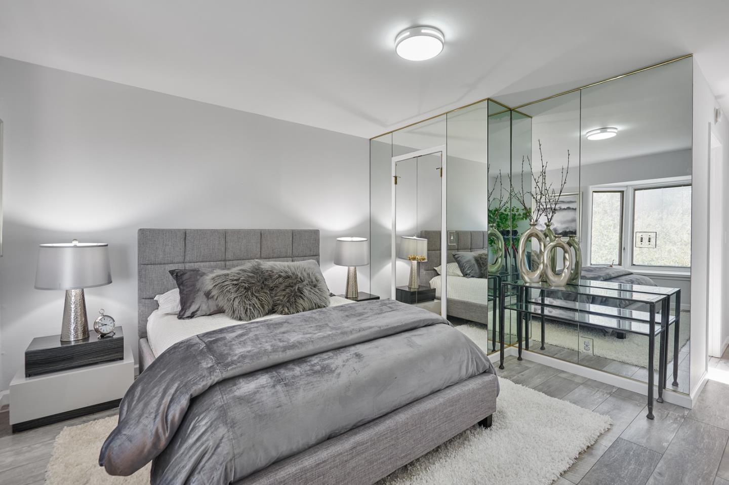 2619 Prindle Road Belmont, CA 94002 - Photo 16 of 27 a bedroom with a bed table and chairs