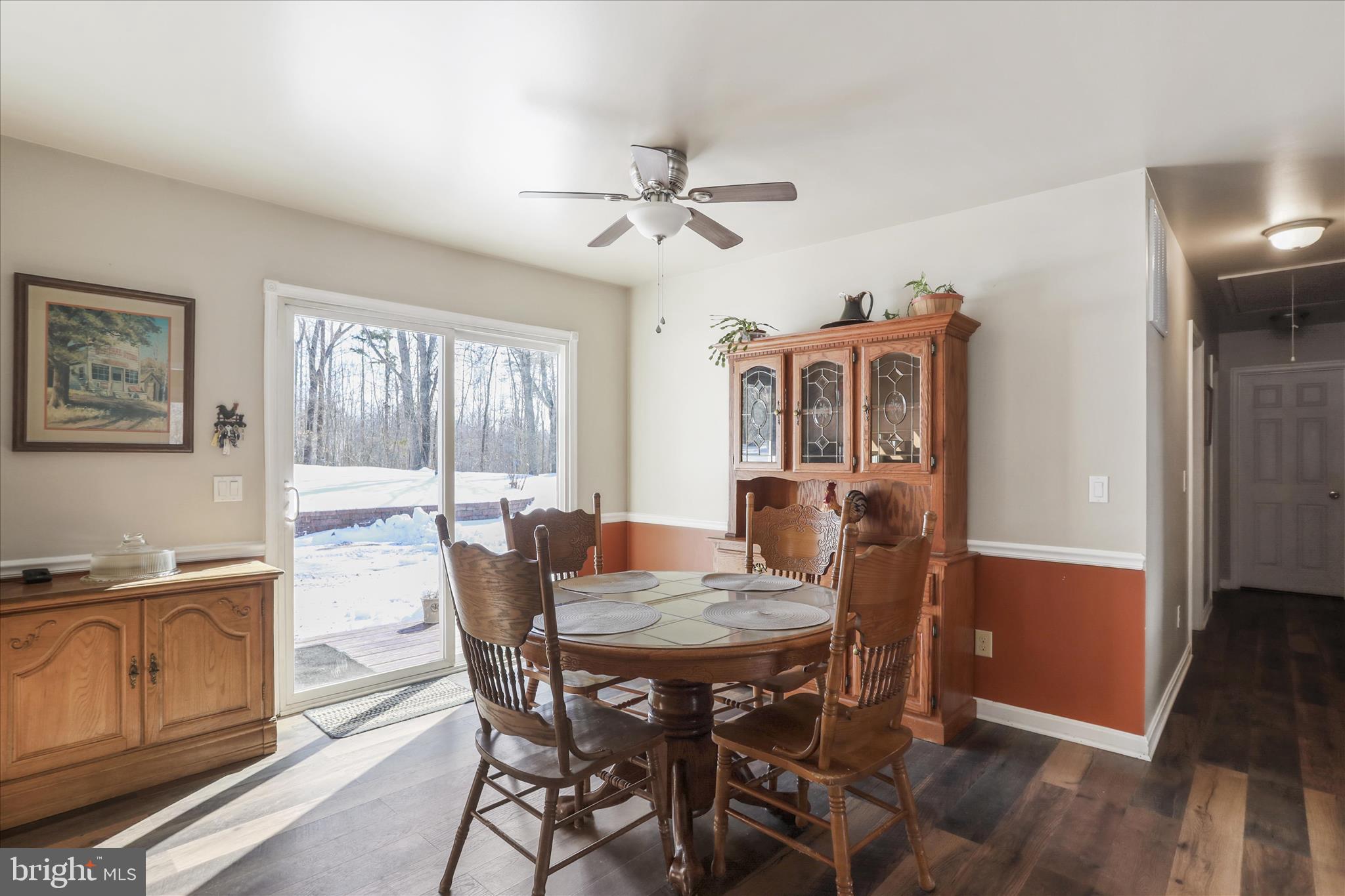 444 Castleton Ford Road Castleton, VA 22716 - Photo 17 of 64 a view of a dining room with furniture window and wooden floor