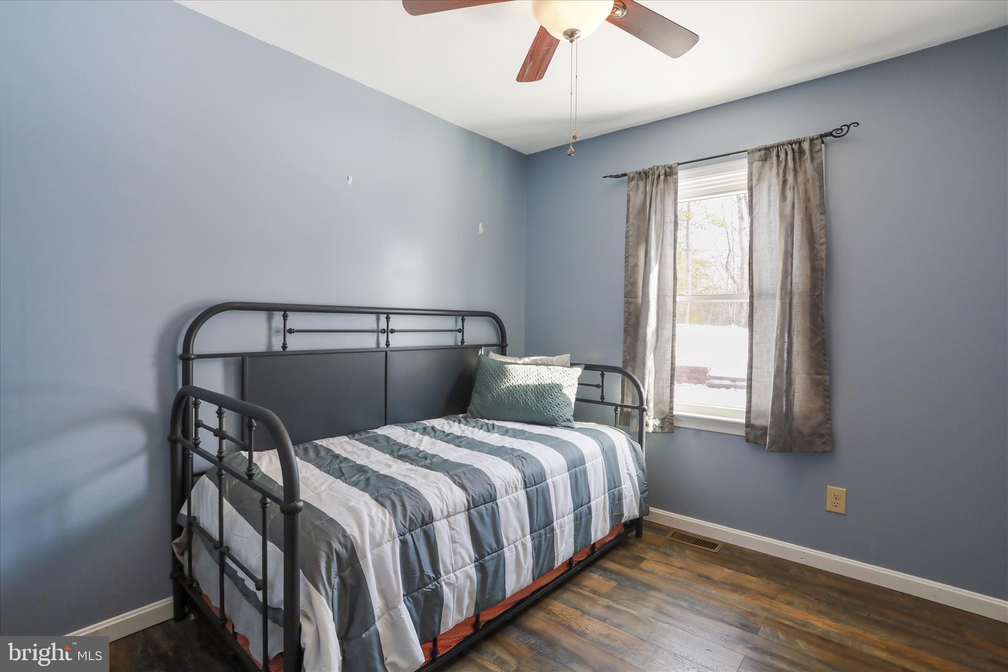 444 Castleton Ford Road Castleton, VA 22716 - Photo 18 of 64 a bedroom with two beds and a window