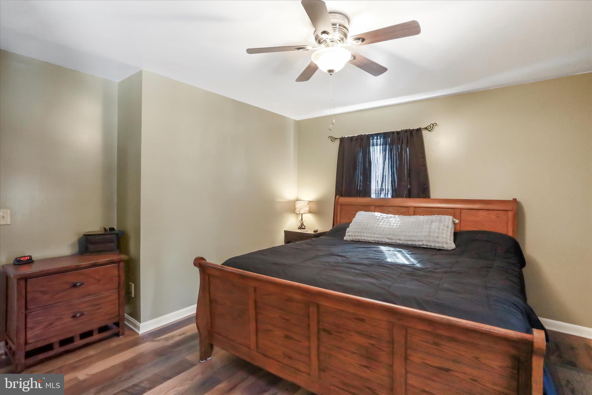 444 Castleton Ford Road Castleton, VA 22716 - Photo 25 of 64 a bedroom with a bed and a dresser