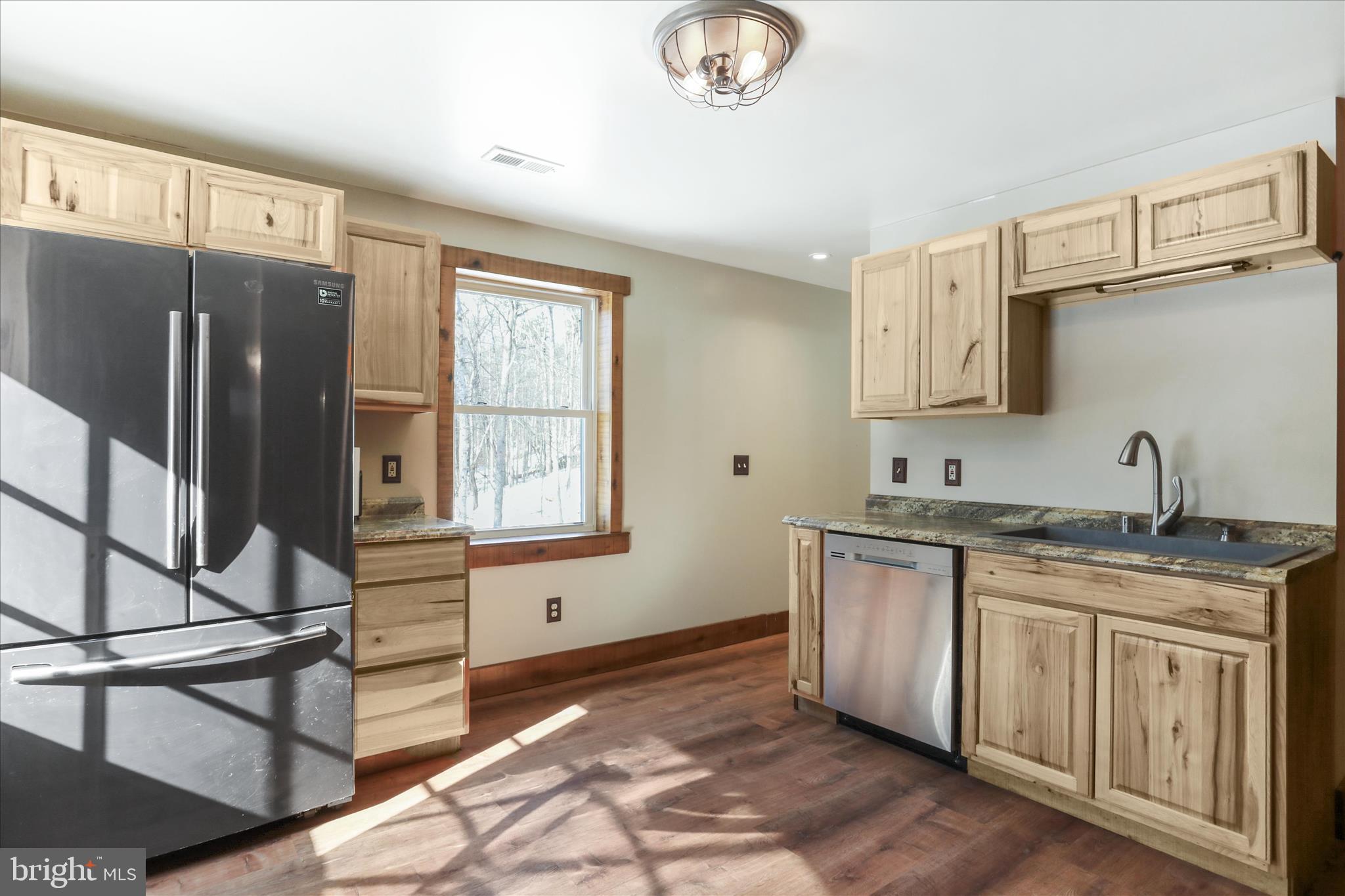 444 Castleton Ford Road Castleton, VA 22716 - Photo 29 of 64 a kitchen with a sink cabinets and stainless steel appliances